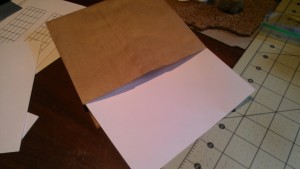 brown lunch paper bag with piece of cardstock